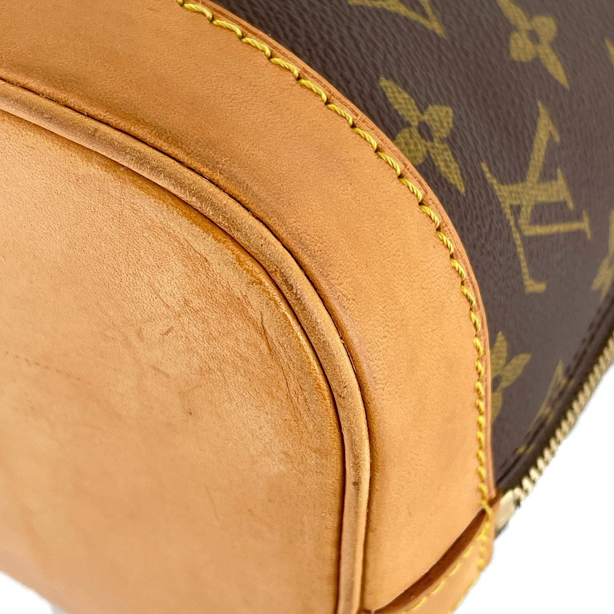 Louis Vuitton Monogram Alma Handbag - Brown, Coated Canvas